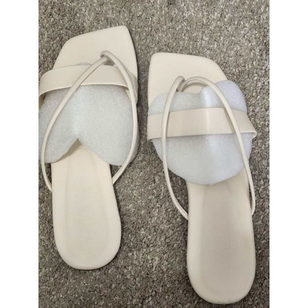 Cream colored flat slip on sandals size 9 Nwot